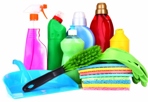 Technician preparing safe sofa cleaning equipment before service