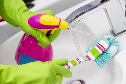 Professional office cleaners working in a reception area