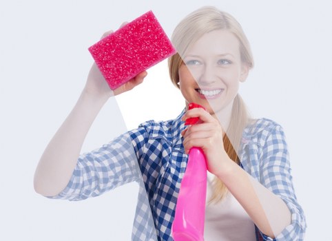 Technician inspecting a sofa before professional cleaning