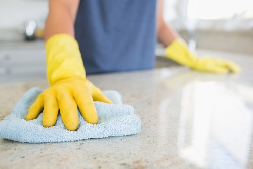 Professional carpet cleaner refreshing office carpets in a business setting